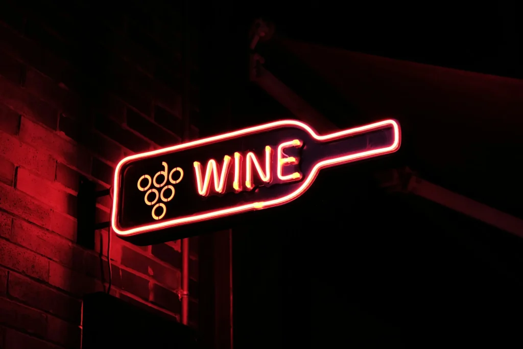 Red neo WINE sign illustrating local wine SEO services at A Wine Line by Maciek Klimowicz